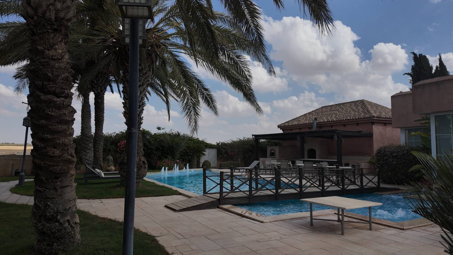 Lawn, gardens and pool at the estate